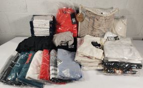 A quantity of assorted as new clothing to include Adidas, Wilson, Levi's and others.