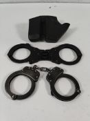 Two pre-owned handcuffs, no-keys to include Vipertek and Smith & Weston M100-0.