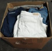 A box of pre-owned clothing, mainly Levis and Lee denim shorts, various colours and sizes.