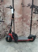 A pre-owned Segway Ninebot electric scooter and charger (requires UK adaptor).