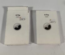 A pack of four Air Tags and two unused Air Tags.