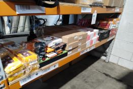 A shelf of assorted out of date food and confectionery products and related (over 18s only).