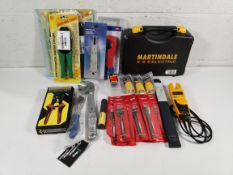 An assortment of as new and pre-owned handheld tools and other related.
