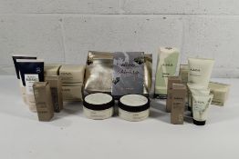 An assorted lot of Ahava products to include Day Cream, Softening Butter Salt Scrub, Mad for Mud and
