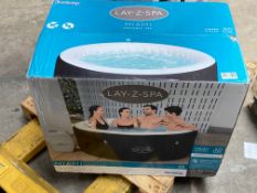 An as new Lay-z-Spa Miami portable spa with freeze shield.