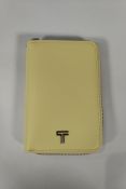 An as new Tumi Belden zip-around passport case, washed yellow (S156544-A871).