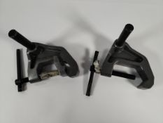 A set of pre-owned Milwaukee metal clamp assemblies (one attachment missing).