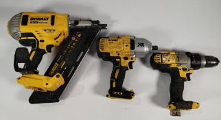 Three pre-owned DeWalt tools - nail gun, impact driver and combi drill (unit only).