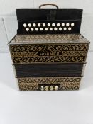 A pre-owned Hohner Pokerwork 2915 Luxury Vienna Diatonic Accordion with some minor damage.