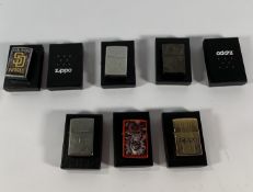 Eight Zippo lighters in boxes (over 18s only).