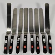 Eight Wusthof cranked narrow blade spatulas 250mm (4437) (over 18s only).
