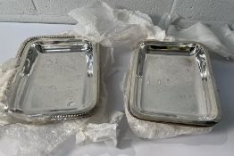 Fifteen stainless steel rectangular dishes, 280 x 200mm (x6) and 254 x 185mm (x9) (may show signs of