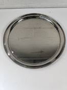 Eight as new stainless steel salvers, round, narrow rim - 406mm (may have some signs of long term st