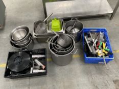 A quantity of commercial catering utensils, knives, pots, pans, cocktail and drinks measurers (over