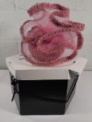 A women's John Boyd England handmade pink luxury hat.