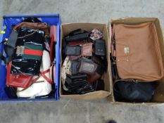 A quantity of assorted pre-owned wallets, purses, handbags and related.