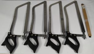 Four bone saws, blade size 40cm, black plastic handle and three smaller width blades (241 191) (over