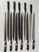 Eleven Wusthof narrow slicer bolstered knives, 320mm (4520) (over 18s only) (tray not included).