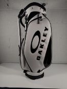An as new Oakley white golf bag 17.0FW.