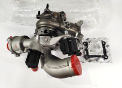 An Audi turbocharger unit (06L145874C).