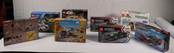 Eighteen assorted Legos to include Star Wars, Creator Bus and related.