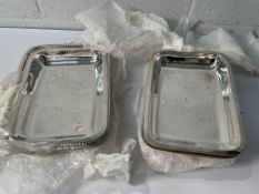 Fifteen stainless steel rectangular dishes, 280 x 200mm (x6) and 254 x 185mm (x9) (may show signs of