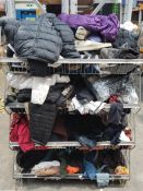 A large quantity of assorted pre-owned clothing in four baskets.