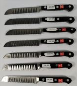 Seven Wusthof fluted decorating bolstered knives 110mm (4200) (over 18s only).