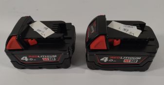 Two Milwaukee M8B4 M18 4.0AH power tool batteries.