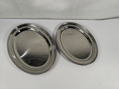 Eighteen as new stainless steel oval dishes, flat - 406mm (x6) and 457mm (x 12) (may show signs of l