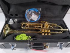 A pre-owned Yamaha student trumpet with hard case and accessories.