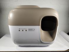 A pre-owned PetSnowy Self Cleaning Litter Box (may be incomplete/sold as seen).