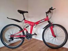 A pre-owned red Cross folding mountain bike (Stock Image).