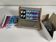A Neon Egg Planetarium 3 Guitar Effects Pedals.
