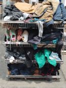 A large quantity of assorted pre-owned clothing in four baskets.