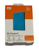 Six as new WD My Passport 2TB USB 3.0 External HDD in Blue (EAN: 718037870281) (Boxes sealed).