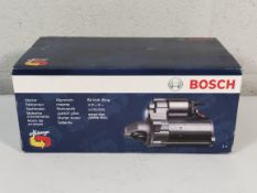 An as new Bosch starter motor (REF: 0 986 023 380 - 9EG).