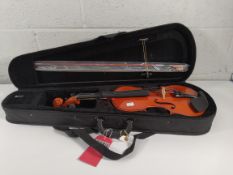 A pre-owned Gear4music student violin, full size in travel case with accessories.
