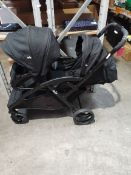 A pre-owned black Jolie Evalite Duo Stroller.