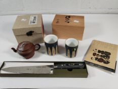 An as new Wang Xiaofeng Palace Lantern teapot and 2x teacups and used Samai Waku chef knife (over 18