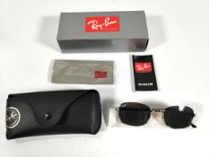 An as new pair of Ray Ban Arista frame with green lens sunglasses with case and box (RB3690 001/31)