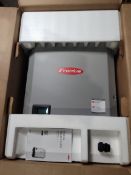 A boxed Fronius Symo solar inverter (light 17 5-3-m).