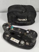 A preowned Grabo lifter with battery and case. (some damage to plastic body)
