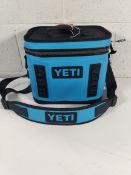 A pre-owned Yeti Hopper Flip 8 Big Wave blue cooler bag.