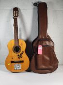 A pre-owned Raimundo 104-B acoustic guitar with case.