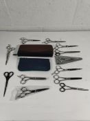 Sixteen pairs of pre-owned hairdressing scissors to include Jaguar, Kensai (over 18s only).