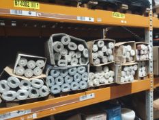 Approximately one hundred rolls of assorted Lettuce wallpaper.