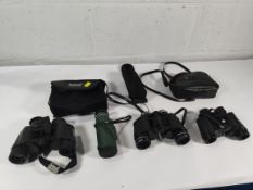 A pair of pre-owned Bushnell 7 x 35 binoculars and 2 x others.