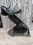 A pre-owned Baby Jogger City Tour 2 stroller with travel case.