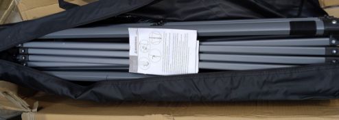 An as new black collapsing gazebo FTPLCG-0563.